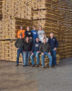 welter seed employees in front of bagged seed